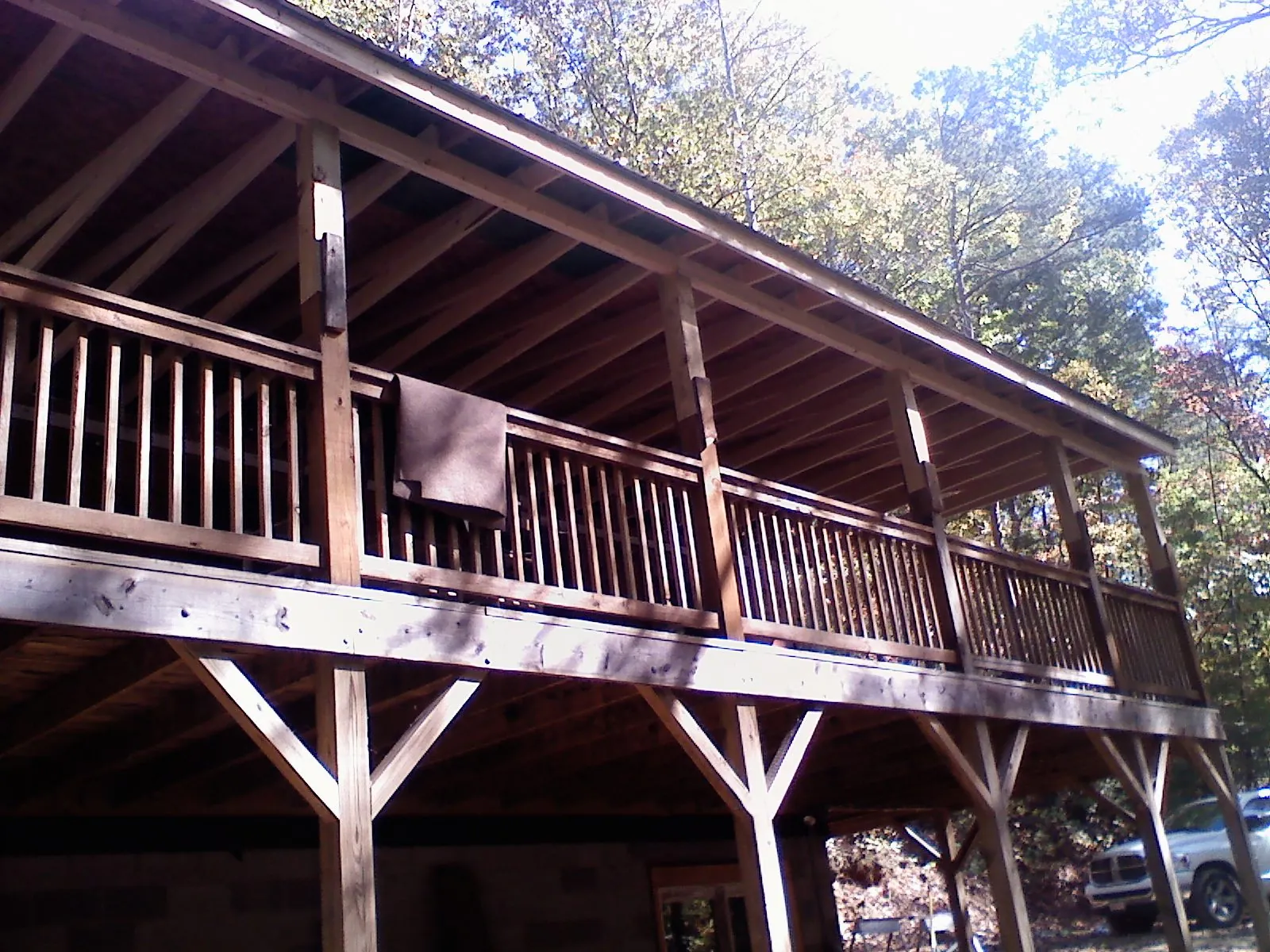 Timber framing under a new elevated porch and deck — Roof Leak Repair in Friesland by Roofing Brothers